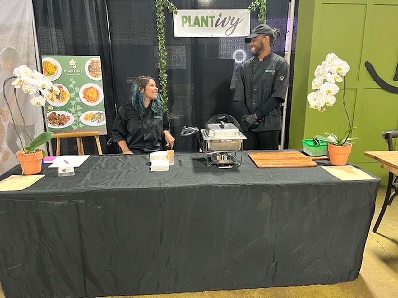 Plant Ivy team members welcoming guests at a professional catering event